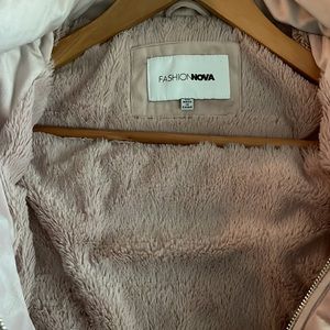 Mauve color fur hood waist length jacket never worn.